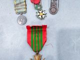several medals and a medal on a table with a coin