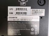 a label on the back of a laptop that says this way up
