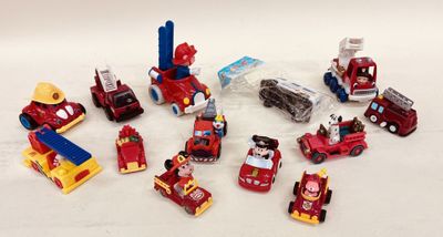 a lot of toy vehicles that are on the table