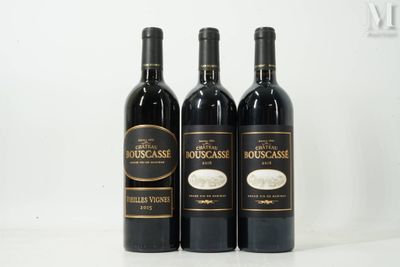 three bottles of wine sitting on top of a table next to each other