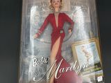 the doll is in a box with a picture of marilyn monroe on it