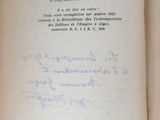 an open book with a handwritten page on it sitting on a table