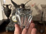 a person holding a glass of water in their hand