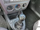 a close up of a car dashboard with a gear stick