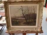 a picture of a painting on a easel in a room
