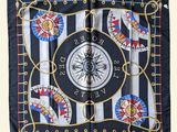 a picture of a square scarf with a compass on it