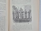 an open book with a picture of a group of people on it