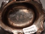 a silver bowl with a tag on it