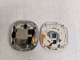two pieces of metal that have been removed from the back of a cell phone