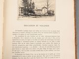 an open book with a picture of a house on it