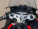a close up of a motorcycle ' s dashboard and handlebars