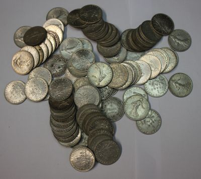 a pile of coins sitting on a table next to each other