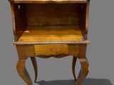 an old wooden desk with a drawer on top of it