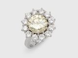 a close up of a diamond ring on a white background