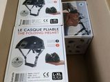 two boxes that have helmets in them on top of each other