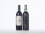 two bottles of wine sitting next to each other on a table