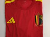 a red shirt with a yellow and red stripe on it