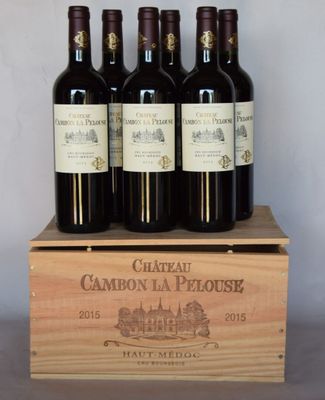 six bouteilles de Château Cambon-la-Ploue dans une caisse en bois