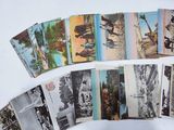 a lot of old postcards on a white surface