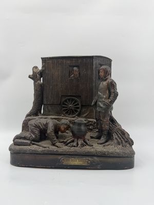 statue représentant un homme et une femme devant une calèche