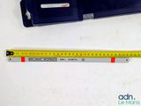 a ruler that is next to a ruler on a table