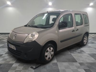 a picture of a small grey van parked in a room