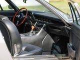 a car with the door open and a steering wheel in the passenger seat