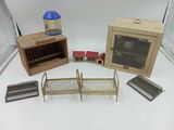 three different types of bird cages on a white table