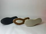 three pairs of shoes are lined up on a white surface