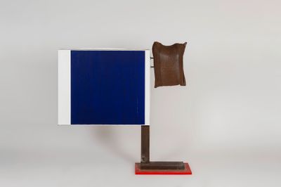 a close up of a blue and white flag on a wooden stand