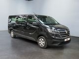 the black van is parked in a large room with white walls