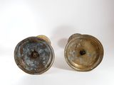 pair of antique brass candlesticks on a white background