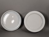 two plates that are sitting on a table