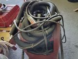 a man working on a machine in a garage