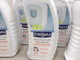 several bottles of starwax deterant are lined up on the floor
