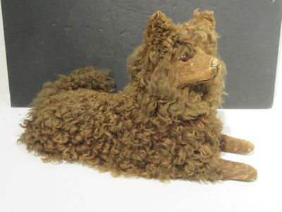 a stuffed animal that is laying down on a table
