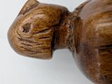 a close up of a wooden cat head on a white background