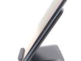 a cell phone that is sitting on a stand