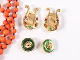 an image of a necklace, earrings, and a necklace of orange beads