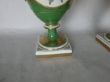 a green vase that has a picture of a horse on it