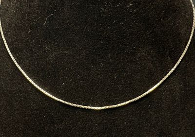 sterling silver snake chain necklace on a black velvet necklace stand