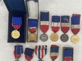many medals and medals in a case on a table