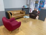 two couches and a chair in a room