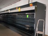 a empty supermarket aisle with empty shelves in the background