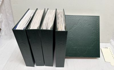 several books are stacked on top of each other on a table