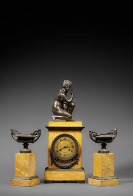 an image of a clock with a statue of a man sitting on top of it