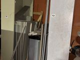 a refrigerator and a refrigerator freezer in a room