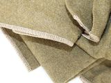 a close up of a pile of cloth on a white surface