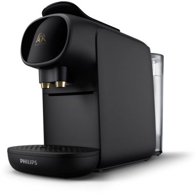 une machine à café noire posée sur un plan de travail blanc