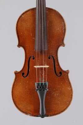 an old violin with a bow on a white background